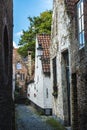 Narrow street with old houses in Bruges, Belgium Royalty Free Stock Photo