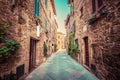 Narrow street in an old Italian town of Pienza. Tuscany, Italy. Vintage