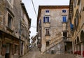 Narrow street and old residential houses of alleys in the Croatian artists' village of Groznjan Royalty Free Stock Photo