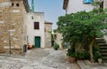Narrow street with old residential houses of alleys in the Croatian artists' village of Groznjan Royalty Free Stock Photo