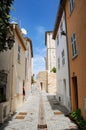 Narrow street in old town of Antibes, French Riviera, Provence, France Royalty Free Stock Photo