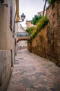 Narrow street in old town with a bridge, Palma de Mallorca, Spain