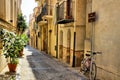 Narrow street in the old town of Cefalu, Sicily, Italy Royalty Free Stock Photo