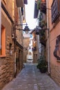 Narrow street in old town, Europe. Downtown in mountains, Spain. Facade of ancient houses. Historical cityscape. Empty town.