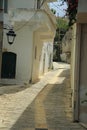 A narrow street in the old town on the island of Crete, Greece Royalty Free Stock Photo