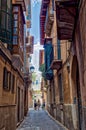 Narrow street in the old town of Palma de Mallorca, Spain Royalty Free Stock Photo