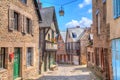 Narrow street with old traditional houses in Dinan