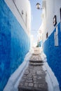 Narrow street with painted blue walls