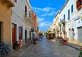 02.09.2018. Narrow street with people, old buildings and facade with outdoor tables and restaurant chairs in historical part of vi