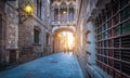 Narrow street with popular bridge in Gothic Quarter at dusk, Barcelona Spain. Royalty Free Stock Photo