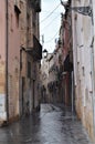 Narrow street in the rainy day