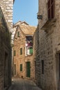 Narrow street of Stari Grad, Hvar island, Dalmatia, Croatia Royalty Free Stock Photo