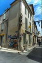 Narrow street statue building Arles