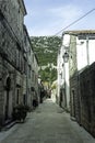 Narrow street in Ston with Great Wall in background in Ston, Croatia Royalty Free Stock Photo