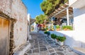 Narrow street with stone houses in Lefkes village Royalty Free Stock Photo