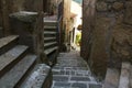 Narrow street with stone stairs in a town from Tuscany