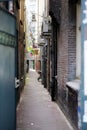 Narrow street between two houses in Amsterdam, Netherlands Royalty Free Stock Photo