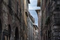 Narrow street with typical italian houses in Lucca, Tuscany