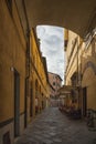 Narrow street with typical italian houses in Lucca, Tuscany