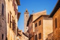 Narrow Street Via San Giovani and Cuganensi Tower in San Gimignano, Tuscany Royalty Free Stock Photo