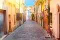 Narrow street of the village of fishermen San Guiliano with colorful houses and a bicycle in early morning in Rimini, Italy Royalty Free Stock Photo