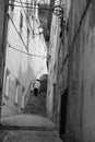 Narrow street and vintage street light in Alcacer do Sal