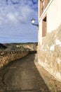 Narrow street and vintage streetlight in Priego town