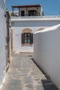 Narrow street with white walls taken in lindos rodos greece Royalty Free Stock Photo
