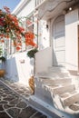 The narrow streets of the island with blue balconies, stairs and flowers. Royalty Free Stock Photo