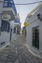Narrow streets in the center of Chora, Tinos with traditional architectural buildings in Tinos island, Greece