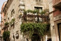 The narrow streets of the city of Taormina with its stores and medieval buildings on a sunny day. Sicily island, Italy.