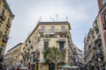 Narrow streets in downtown in Rione Sanita neighborhood in Naples Stella quarter with hanging colorful laundry and traffic