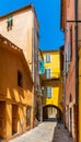 Narrow streets and historic houses of old town quarter with Rue du Poilu street in Villefranche-sur-Mer resort town in France Royalty Free Stock Photo