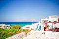 The narrow streets of the island with blue balconies, stairs and flowers in Greece. Royalty Free Stock Photo