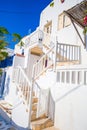 The narrow streets of the island with blue balconies, stairs and flowers. Royalty Free Stock Photo