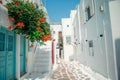 The narrow streets of the island with blue balconies, stairs and flowers. Royalty Free Stock Photo