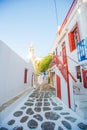 The narrow streets of the island with blue balconies, stairs and flowers in Greece. Beautiful architecture building Royalty Free Stock Photo