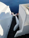 Narrow streets in Oia, Santorini island, Greece. White houses, blue sea.