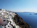 Narrow streets in Oia, Santorini island, Greece. White houses, blue sea.