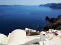 Narrow streets in Oia, Santorini island, Greece. White houses, blue sea.