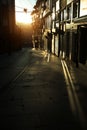 Narrow streets of the old city in the rays of a stunning dawn. Porto