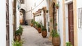 Narrow streets of Rabat, Morocco with hanging lanterns and plants