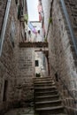 Narrow streets and stone stairs in old town of Kotor. Dwelling antidue houses. Montenegro Royalty Free Stock Photo