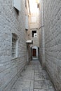 Narrow streets of Trogir, Croatia with white stone houses in the old town Royalty Free Stock Photo