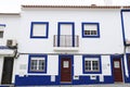 Narrow streets and white houses of Porto Covo town in Portugal