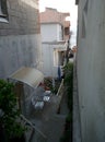 Narrow Tiny Street Small Town Balconies Table Chairs Close Buildings Croatia Europe