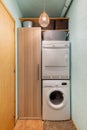 Narrow utility room with washing machine and dryer.