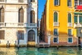 Narrow Venice street between two palaces on the bank of the Gran Royalty Free Stock Photo
