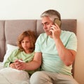 Vertical shot of dad call ambulance for sick son