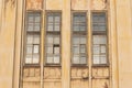 Narrow vertical windows of a century-old factory